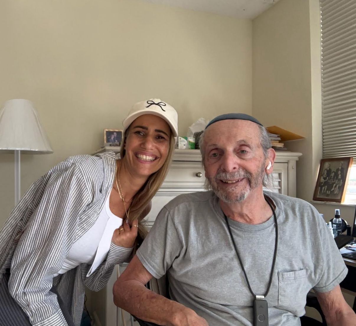 Volunteer and senior smiling